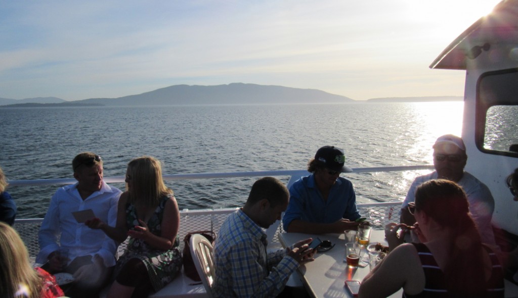 san juan cruises chuckanut bay cracked crab cruise guests enjoying sunshine